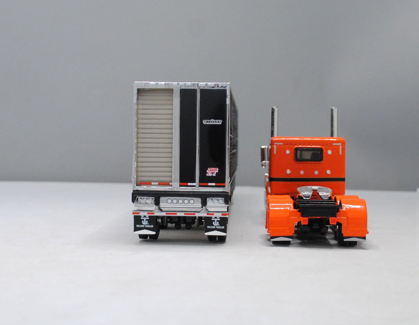 RETIRED #60-1107 Peterbilt Orange & Black Wilson Black Spread Axle Livestock Trailer