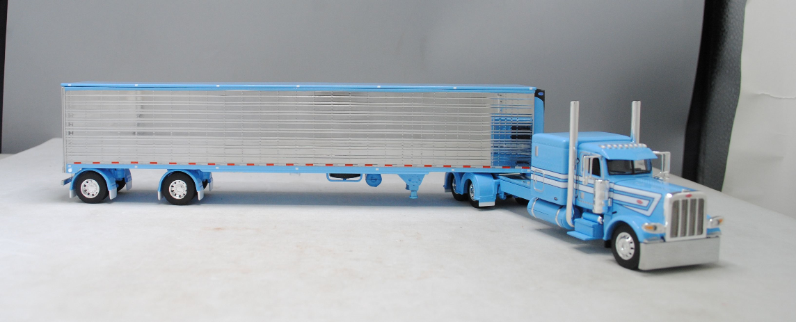 RETIRED #60-1322 1/64 Baby Blue Peterbilt 389 w/Reefer
