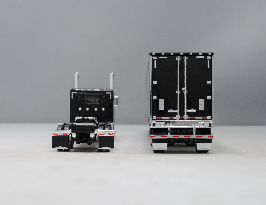 #60-1323 1/64 Black Peterbilt 389 w/Chrome Utility 53' Spread-Axle Carrier Reefer (Black)