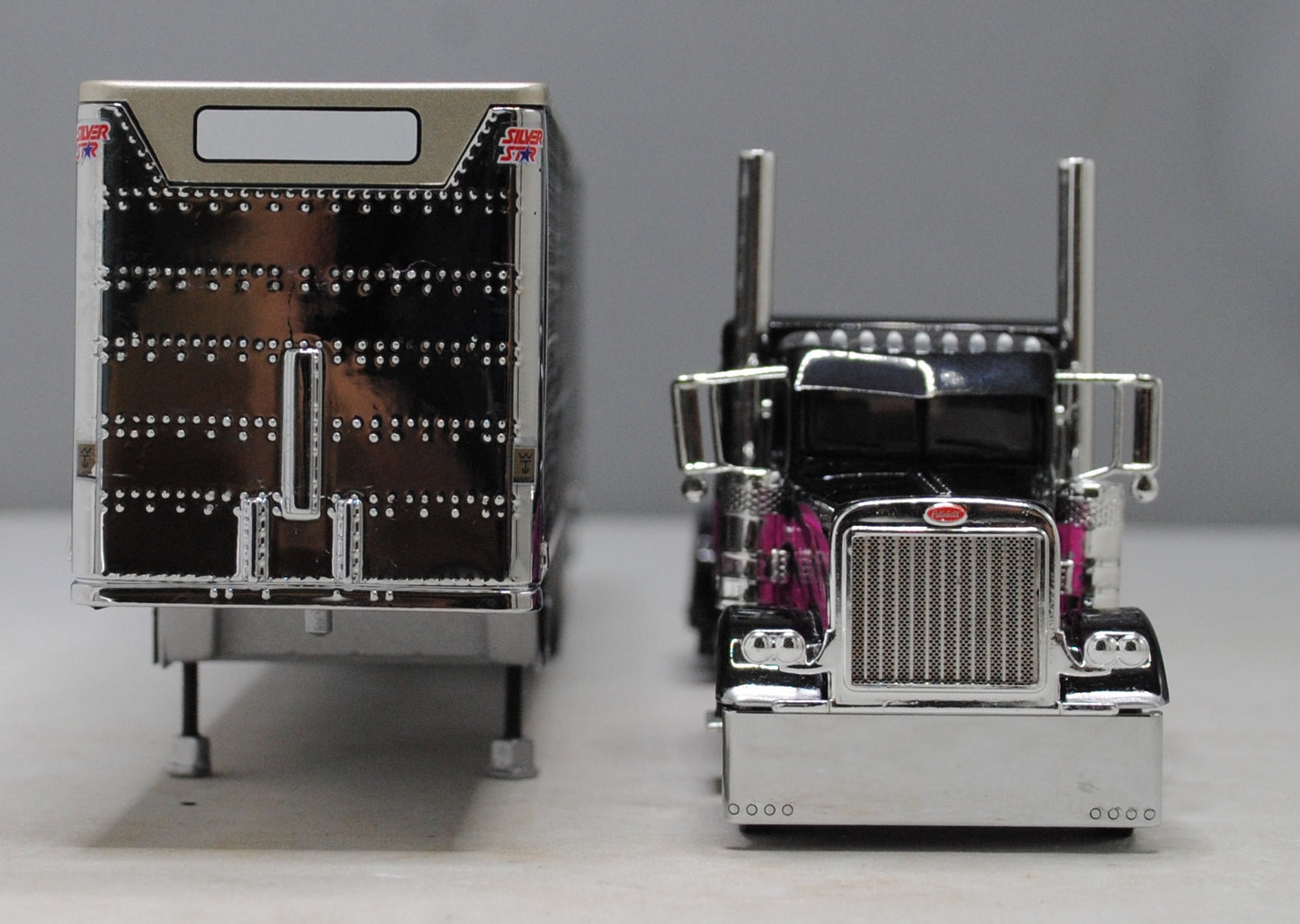 #60-1334 Peterbilt 389 Black/Pink & Gunmetal Gray Quad Livestock Trailer