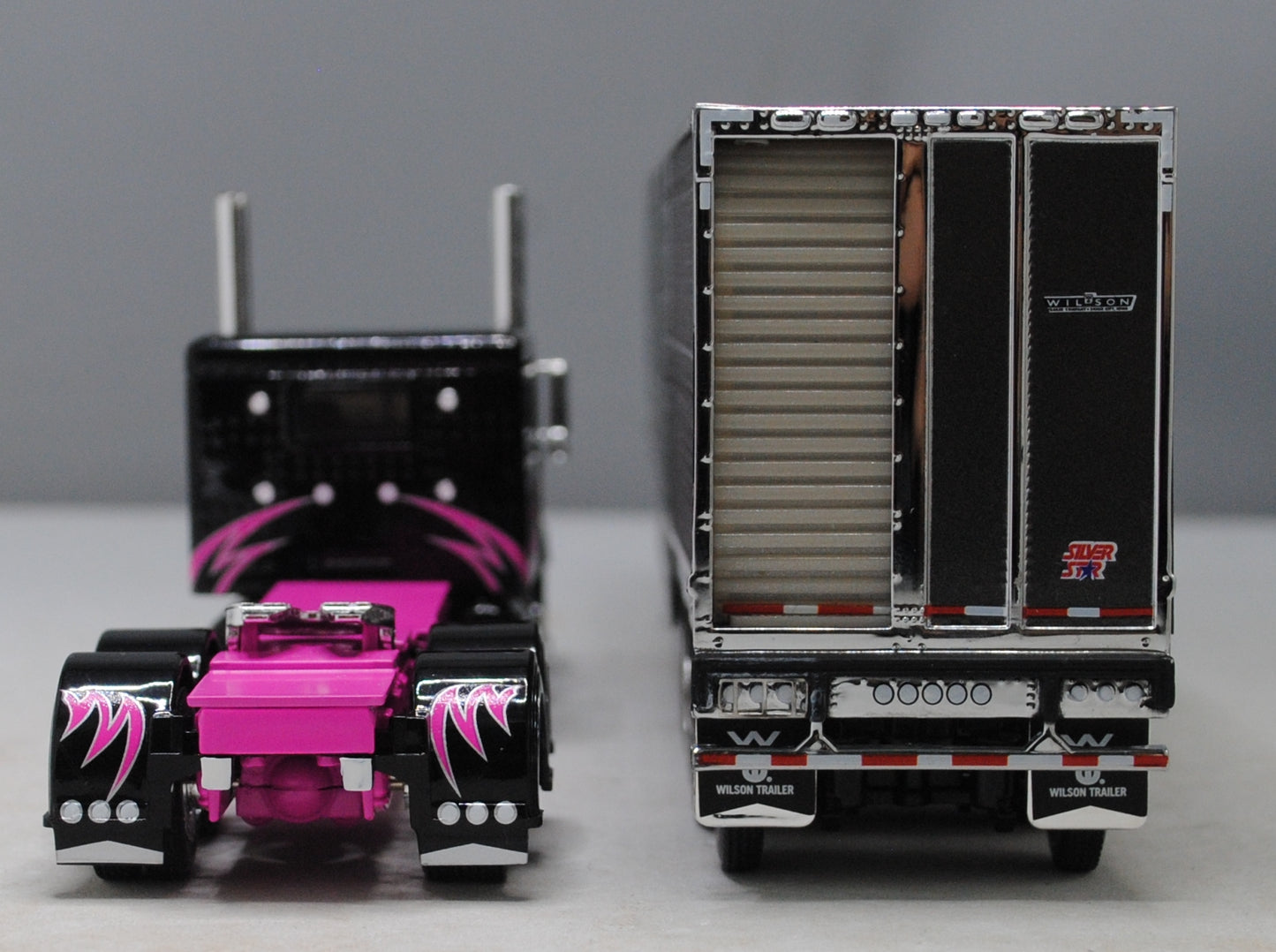#60-1334 Peterbilt 389 Black/Pink & Gunmetal Gray Quad Livestock Trailer
