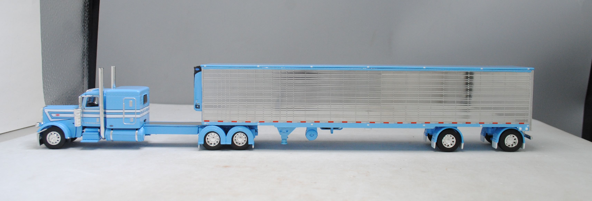 #60-1322 1/64 Baby Blue Peterbilt 389 w/Chrome Utility 53' Spread-Axle Carrier Reefer (Baby Blue)