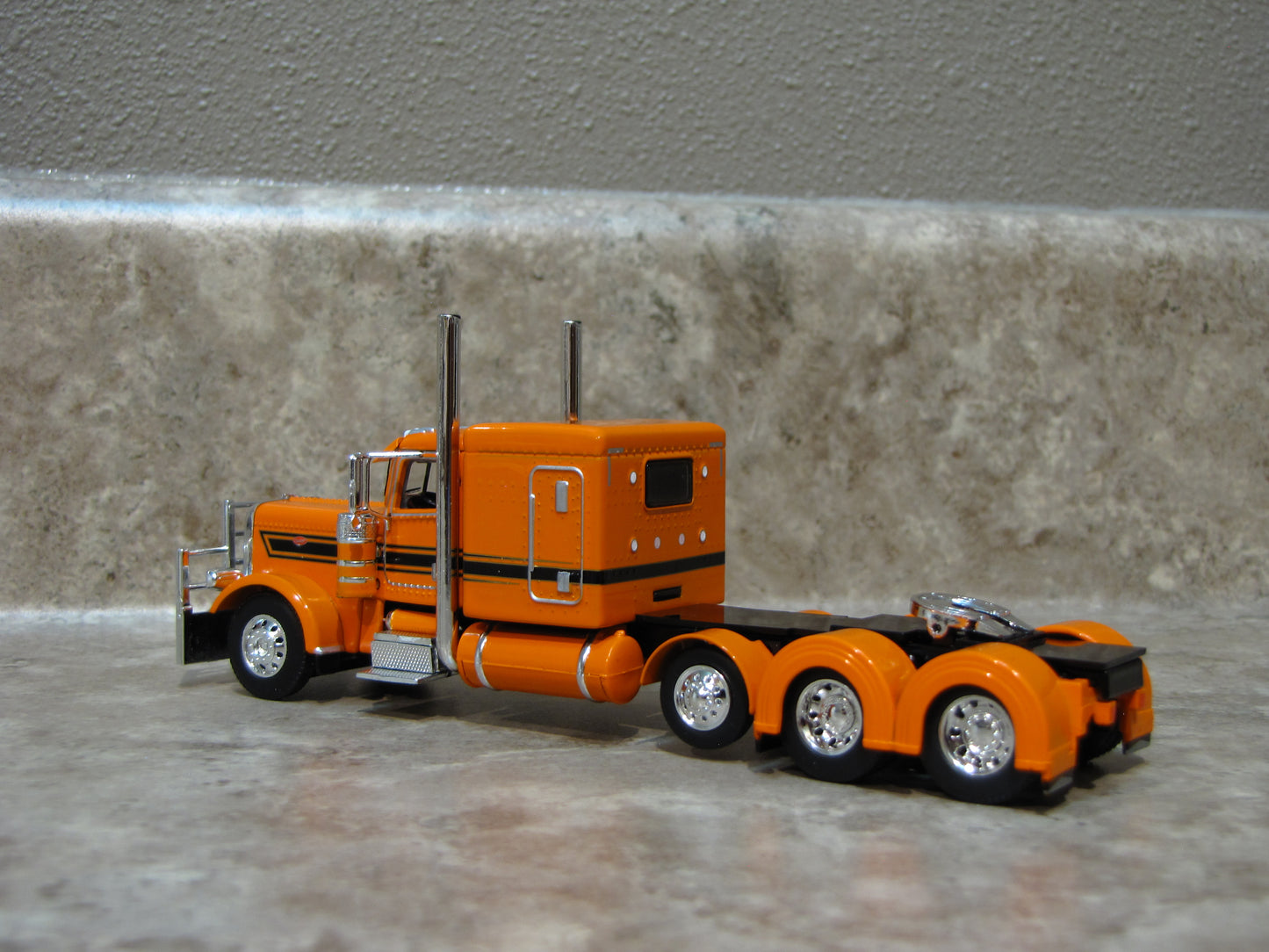 CAB 1107 Orange Black Tri-Axle Peterbilt 389  Semi Truck
